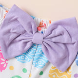 Pair of purple bows on baby girl pants