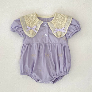 Purple baby romper with floral collar.