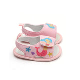 Pink baby girl's sandals with mermaid design.