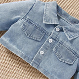 Light blue denim jacket with button details.
