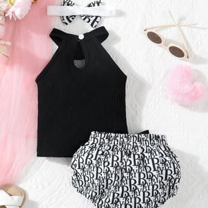 Black halter top and patterned shorts set on a white background.