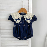 Navy blue baby romper with white lace collar.