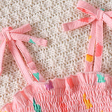 Pink baby girls pink bodysuit with colorful rabbits.