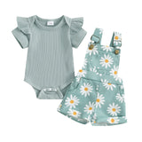 Baby outfit set with ruffled top and floral overalls.