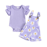Purple baby outfit with ruffled top and floral overalls.