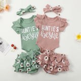 Two baby outfits with 'Auntie's bestie' text, green and pink